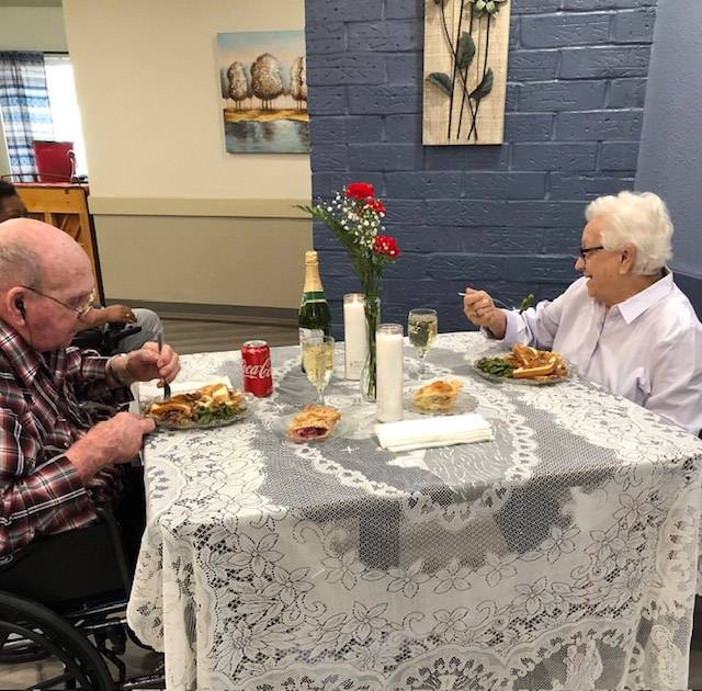 An interior shot of two residents enjoying a meal together at the Greenville Nursing and Rehabilitation Center from the Greenville Gallery.
